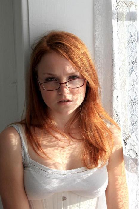 Ginger amateur teen with glasses