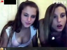 Two girls flashing webcam