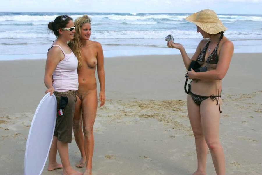 Young naked girls alone on the beach