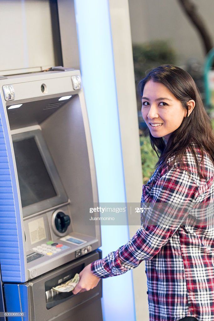Asian lady at atm machine