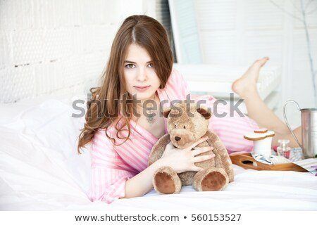Hot girl playing with a teddy bear
