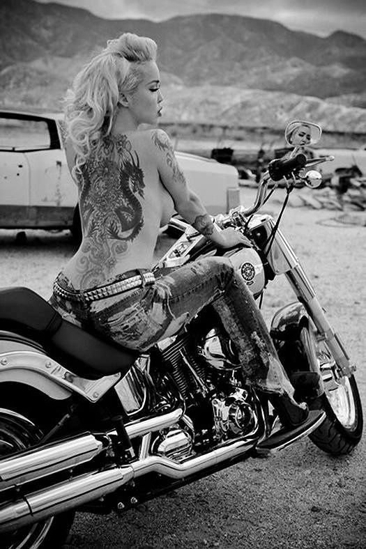 Sexy tattooed nude biker babe