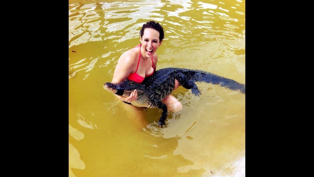 Naked girls on an alligators shot
