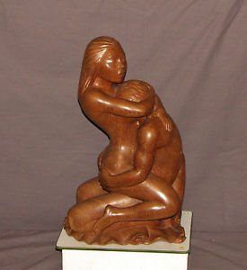 Erotic wood carved statues