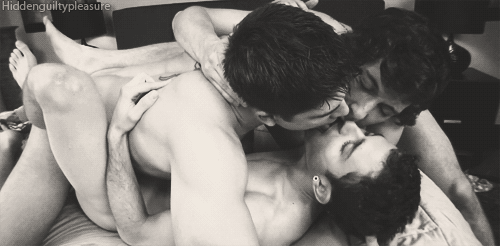 Gay three-some kissing